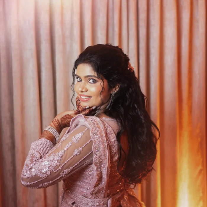 bridal photography poses 13 bride smiling portrait in pink reception gown Tirunelveli Tamil Nadu