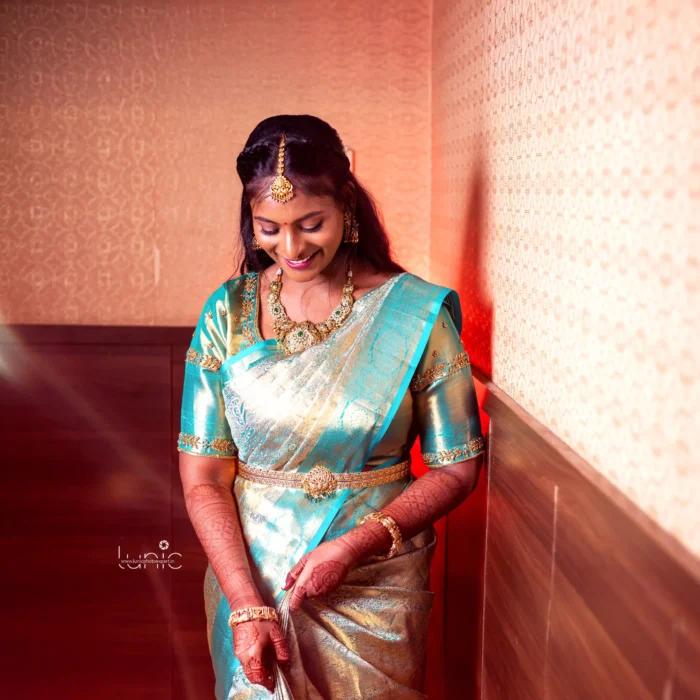 bridal photography poses 16 Traditional South Indian bride in teal blue silk saree looking down shy pose Salem Tamil Nadu